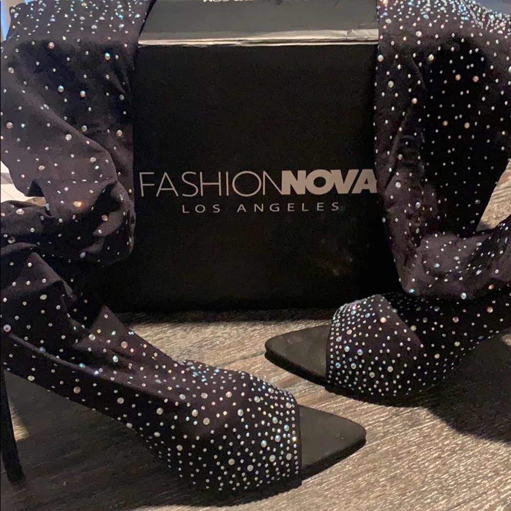 Knee high rhinestone boots from Fashion Nova